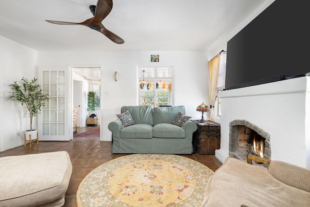 tiled living room with ceiling fan