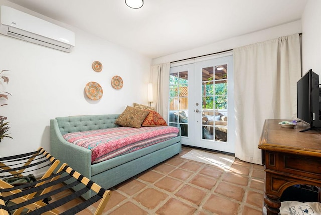 tiled bedroom featuring french doors, access to outside, and a wall unit AC