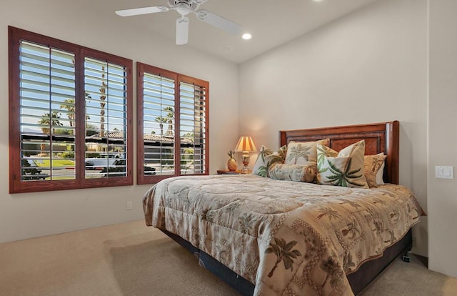 bedroom with ceiling fan and carpet