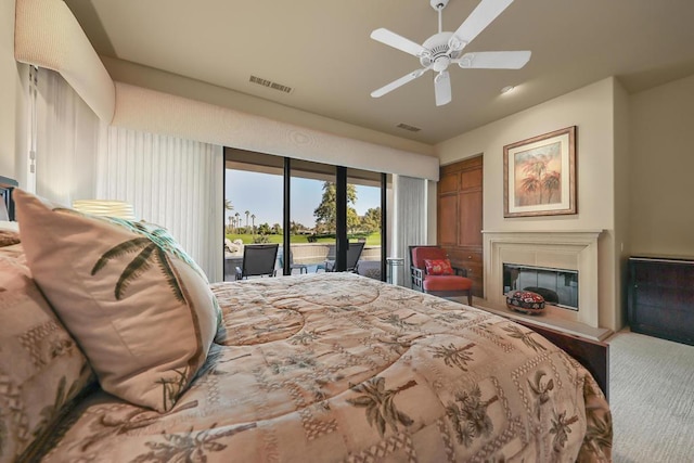 carpeted bedroom with access to outside and ceiling fan