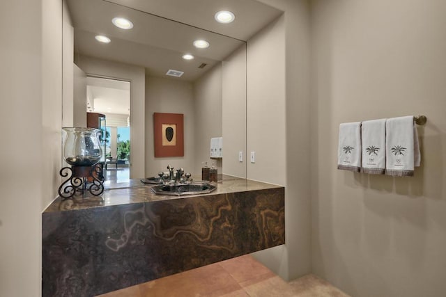 bathroom with tile patterned floors and sink