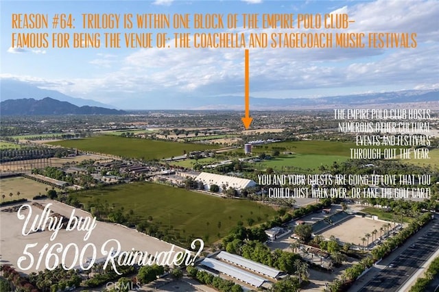 birds eye view of property featuring a mountain view