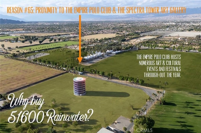 birds eye view of property with a mountain view