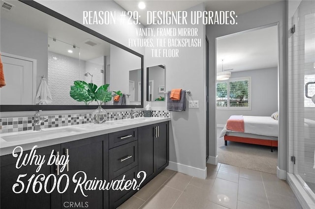 bathroom with tasteful backsplash, tile patterned flooring, vanity, and a shower with shower door