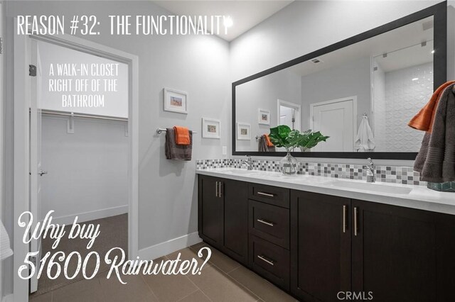 bathroom featuring tile patterned floors, decorative backsplash, and vanity