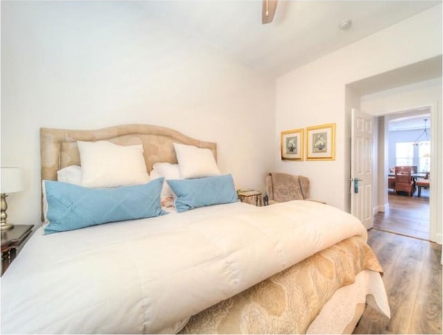 bedroom featuring ceiling fan and wood-type flooring