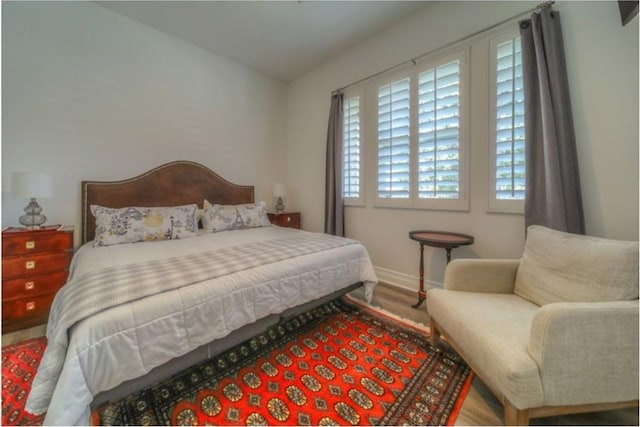 bedroom featuring wood-type flooring