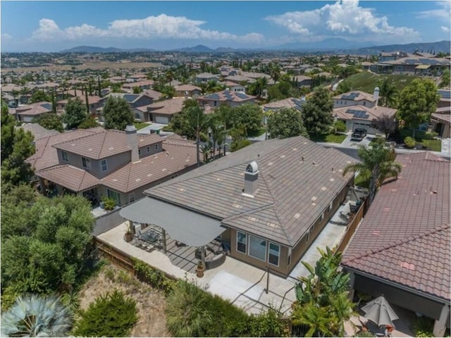 birds eye view of property featuring a mountain view