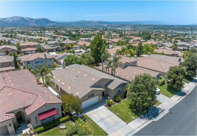 birds eye view of property featuring a mountain view