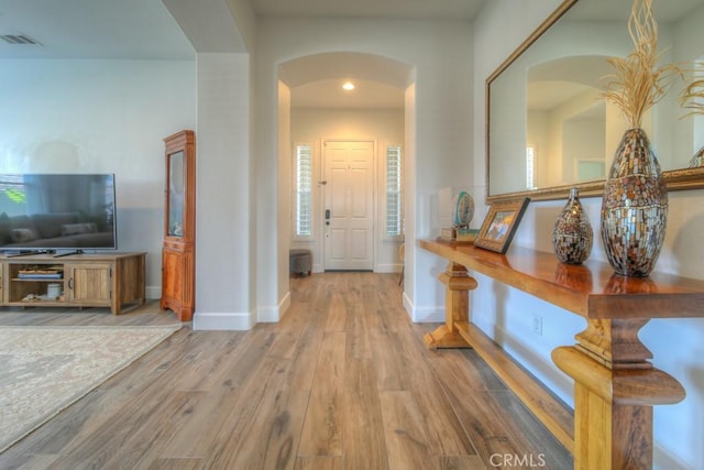 hallway featuring light wood-type flooring