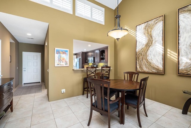 dining area featuring light tile patterned floors