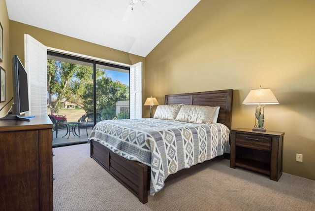 carpeted bedroom with access to outside, vaulted ceiling, and ceiling fan