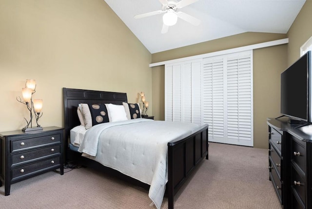 bedroom with light carpet, ceiling fan, and lofted ceiling