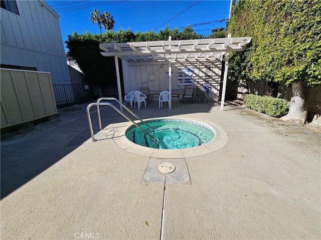 view of pool with a community hot tub, a patio area, and a pergola