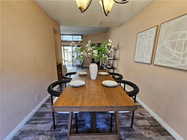 dining space featuring a textured ceiling