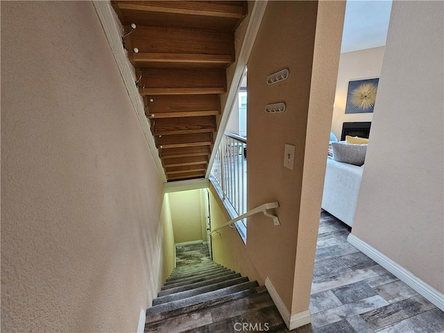 stairway featuring hardwood / wood-style flooring