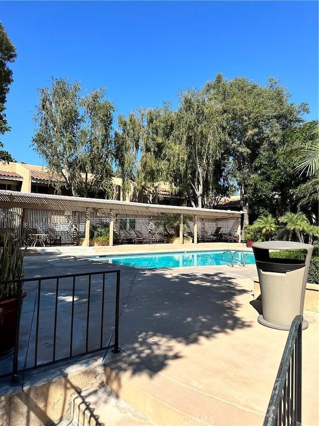 view of pool featuring a patio area