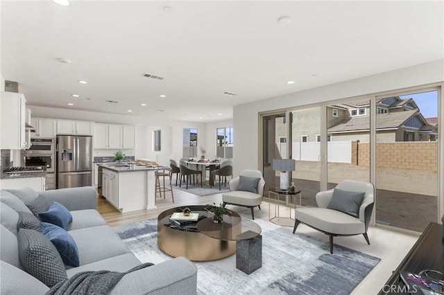 living room with light hardwood / wood-style floors