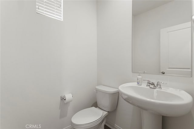 bathroom featuring sink and toilet