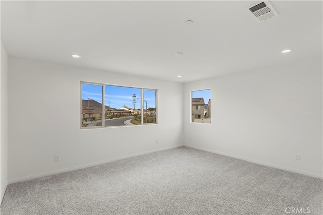 spare room featuring carpet flooring