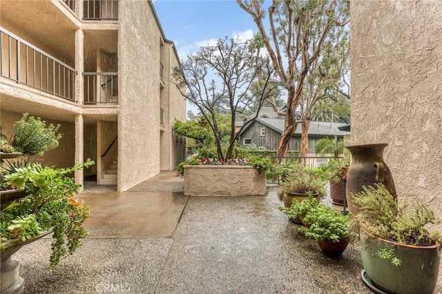 view of home's community featuring a patio area