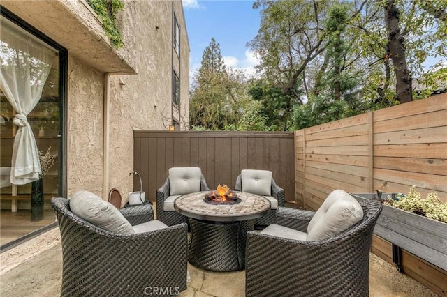 view of patio featuring an outdoor fire pit