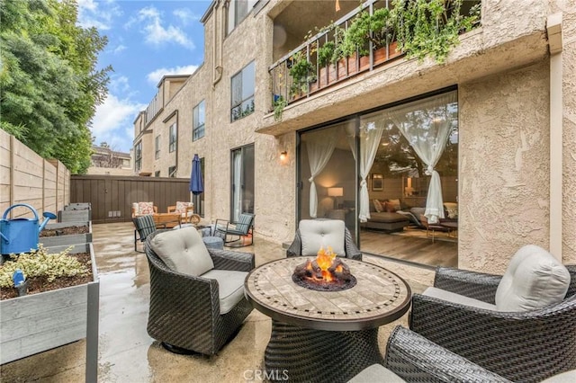 view of patio featuring an outdoor fire pit