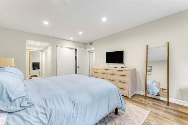 bedroom with light hardwood / wood-style flooring