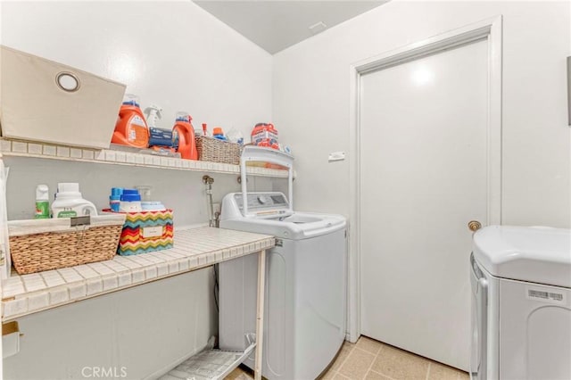 clothes washing area with washer and dryer