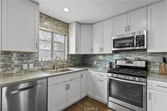 kitchen featuring white cabinetry, appliances with stainless steel finishes, and sink