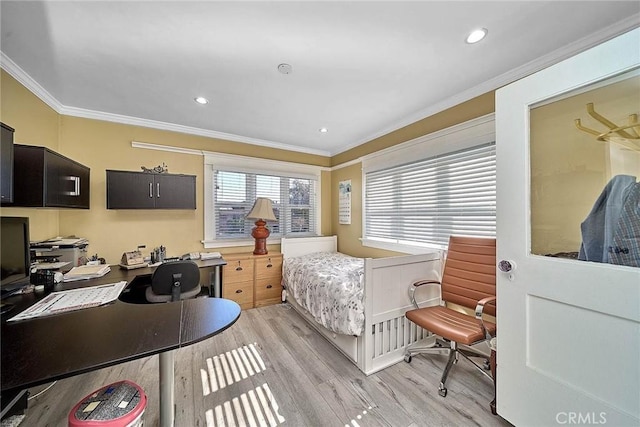 bedroom featuring crown molding and light wood-type flooring