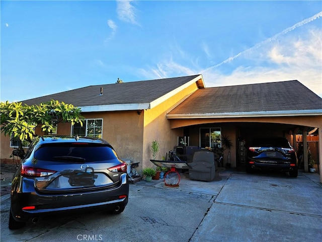 view of home's exterior featuring a carport