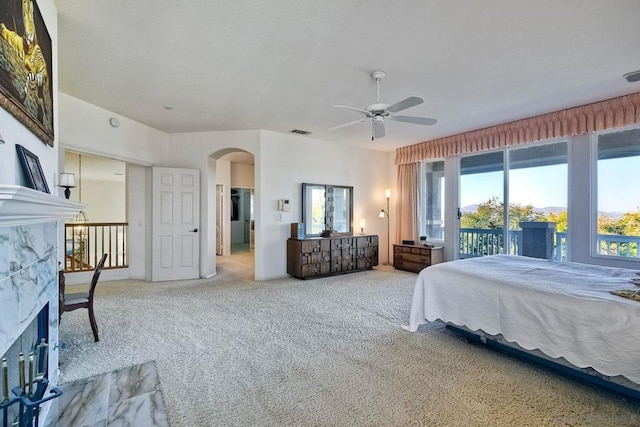 bedroom with ceiling fan, access to exterior, and carpet floors