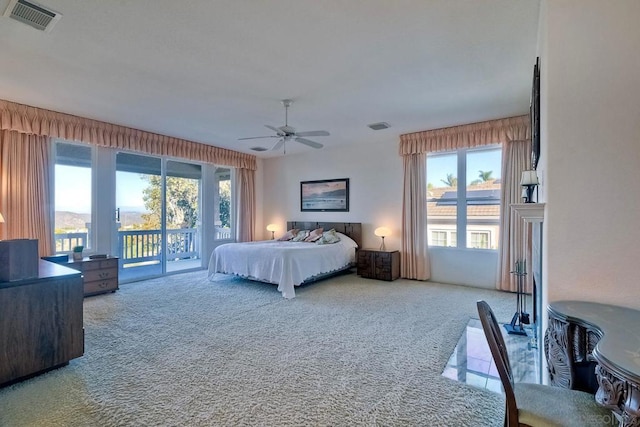 bedroom featuring carpet floors, access to exterior, and ceiling fan