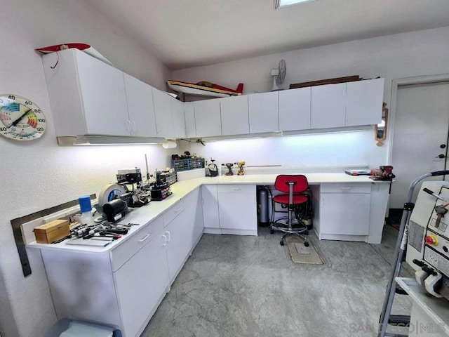 kitchen featuring white cabinets