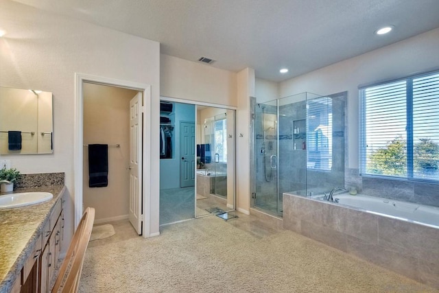 bathroom with vanity and plus walk in shower