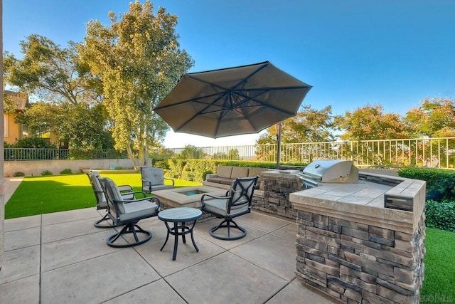 view of patio / terrace featuring an outdoor kitchen, an outdoor living space, and area for grilling