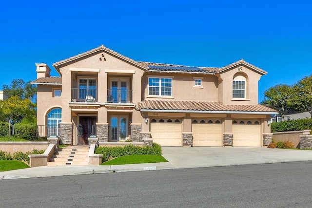 mediterranean / spanish-style home featuring a garage