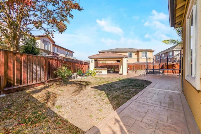 view of yard with a gazebo, a patio area, and a trampoline