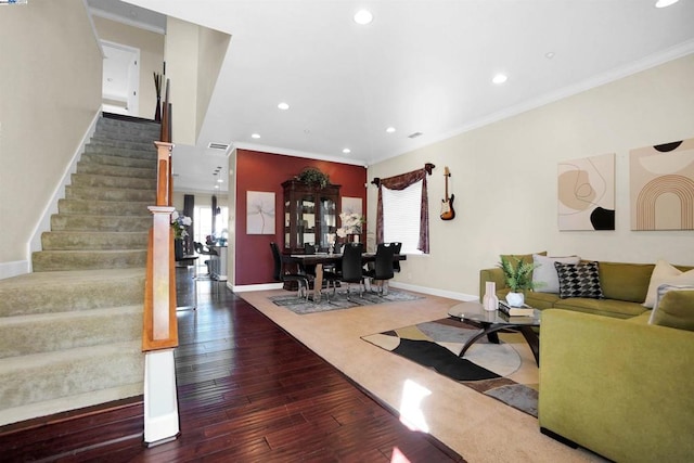 living room featuring ornamental molding, dark hardwood / wood-style floors, and a healthy amount of sunlight