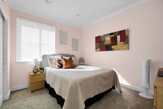 carpeted bedroom featuring crown molding