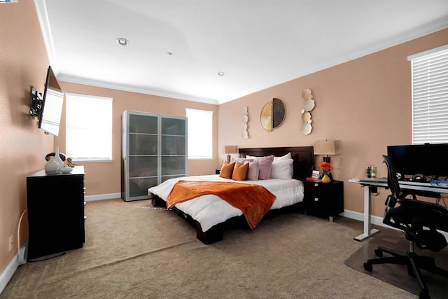 carpeted bedroom featuring multiple windows and ornamental molding