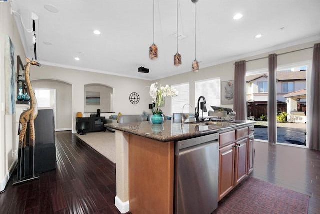 kitchen featuring sink, stainless steel dishwasher, dark hardwood / wood-style floors, dark stone counters, and pendant lighting