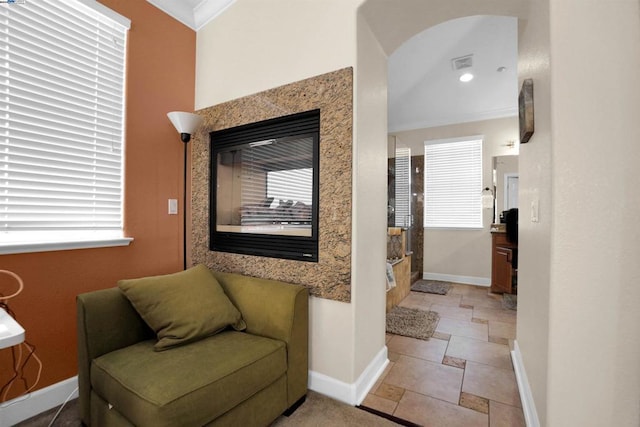 interior space with a healthy amount of sunlight and crown molding