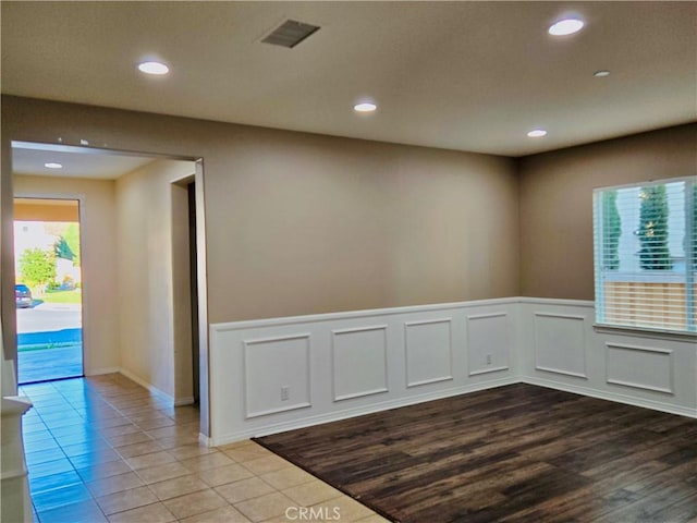 spare room with light wood-type flooring