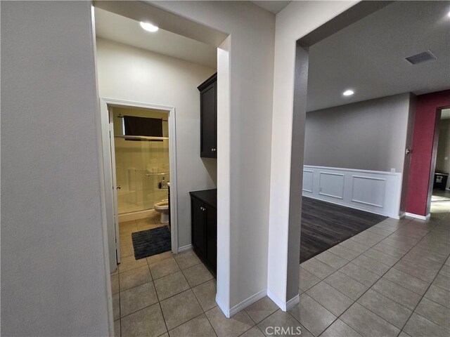 hallway featuring tile patterned floors