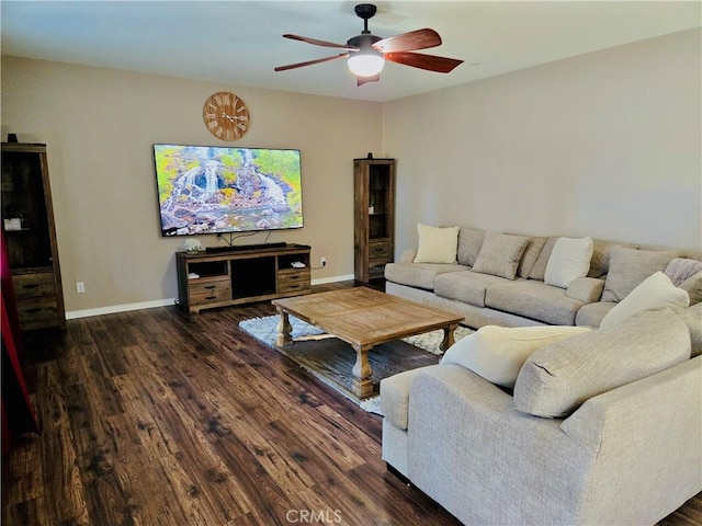 living room with ceiling fan and dark hardwood / wood-style flooring