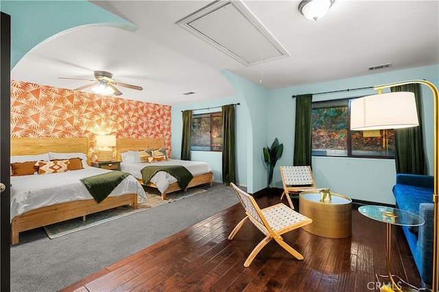 bedroom with ceiling fan and hardwood / wood-style floors