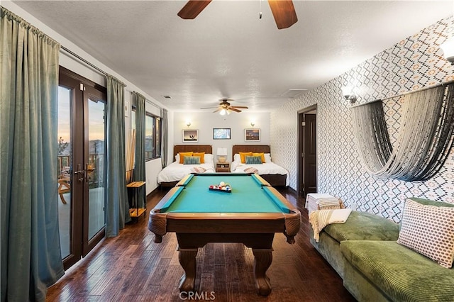 game room with french doors, dark hardwood / wood-style floors, ceiling fan, and billiards