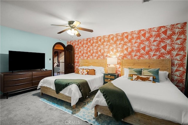 bedroom with ceiling fan and carpet floors